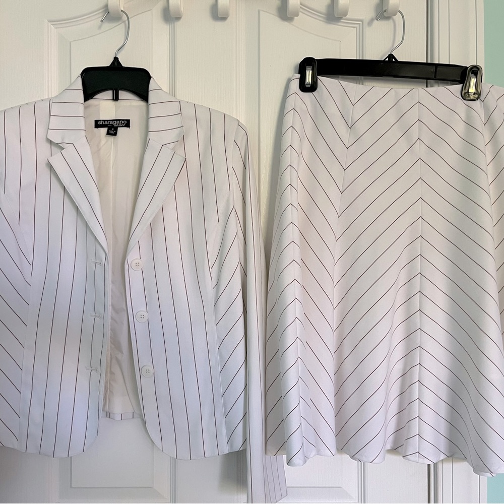 White/Brown striped. Three button jacket. Skirt is lined and flared midi.